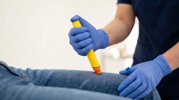 Close up of hands in blue medical gloves administering an epinephrine auto injector epipen shot into the outer thigh of a patient wearing jeans during an allergic emergency - Image credit: solom | stock.adobe.com