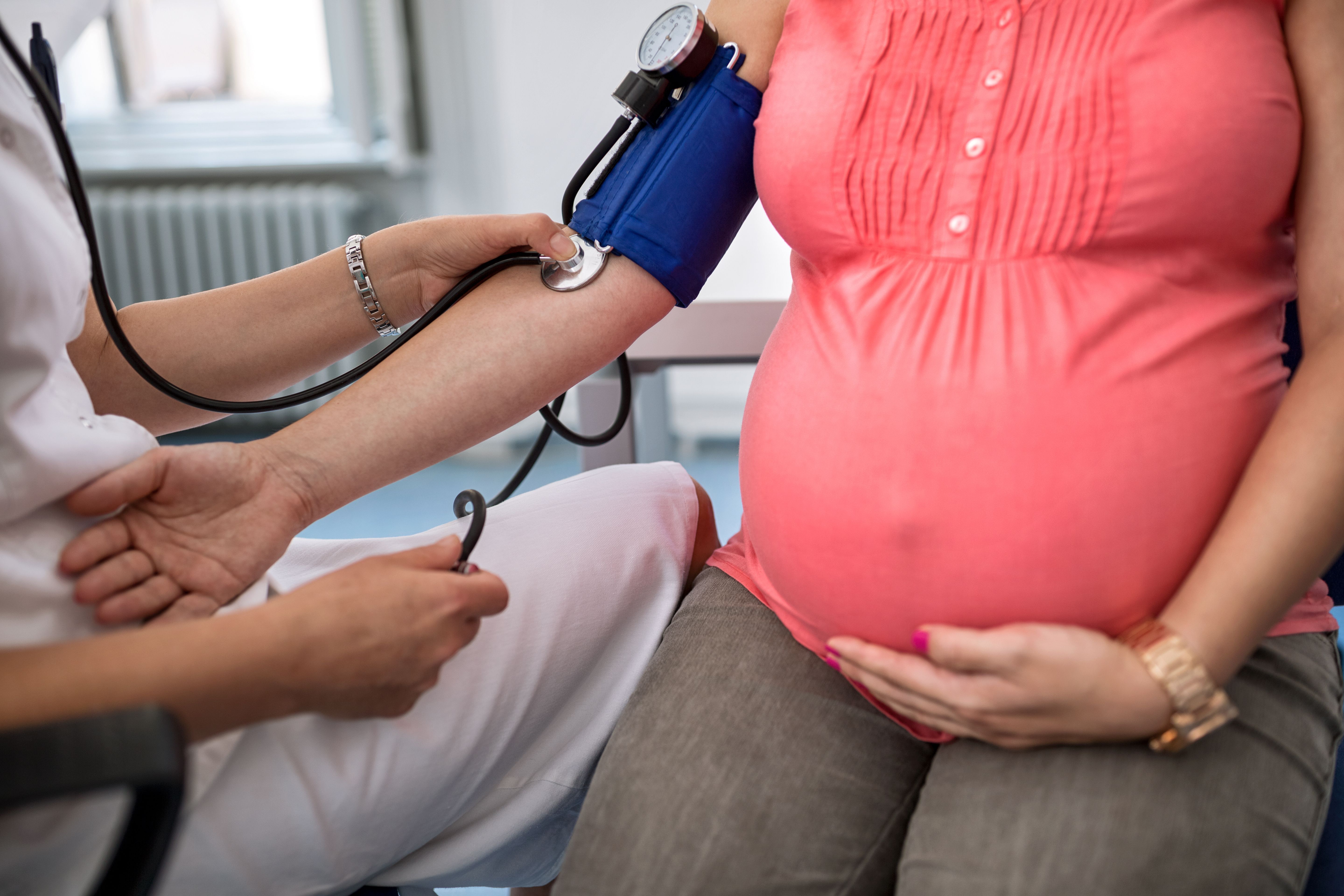 Pregnant woman having her blood pressure taken -- Image credit: didesign | stock.adobe.com