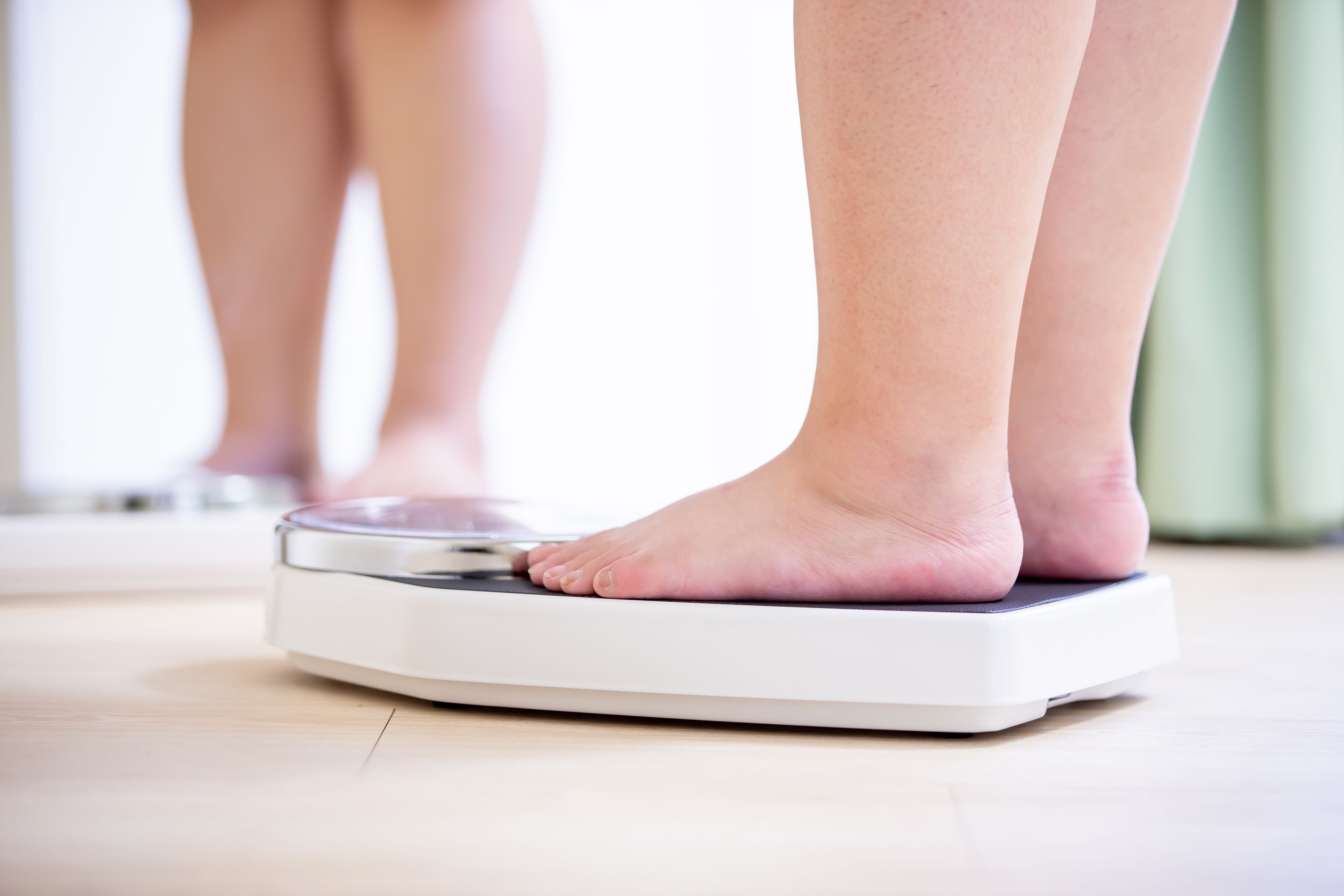 woman measures weight
