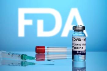 FDA approved Covid vaccine and syringe - photo on a blue gradient background. Antivirus vaccine for coronavirus treatment. Blurred FDA logo for drugstores.