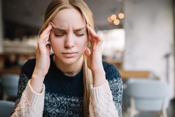 Young woman has headache, stress, migraine. | Image Credit: Oleksii - stock.adobe.com
