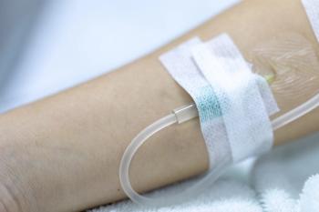 Patient with an IV in their arm -- Image credit: sinhyu | stock.adobe.com
