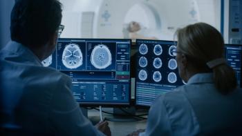 Physicians looking at CT scans
