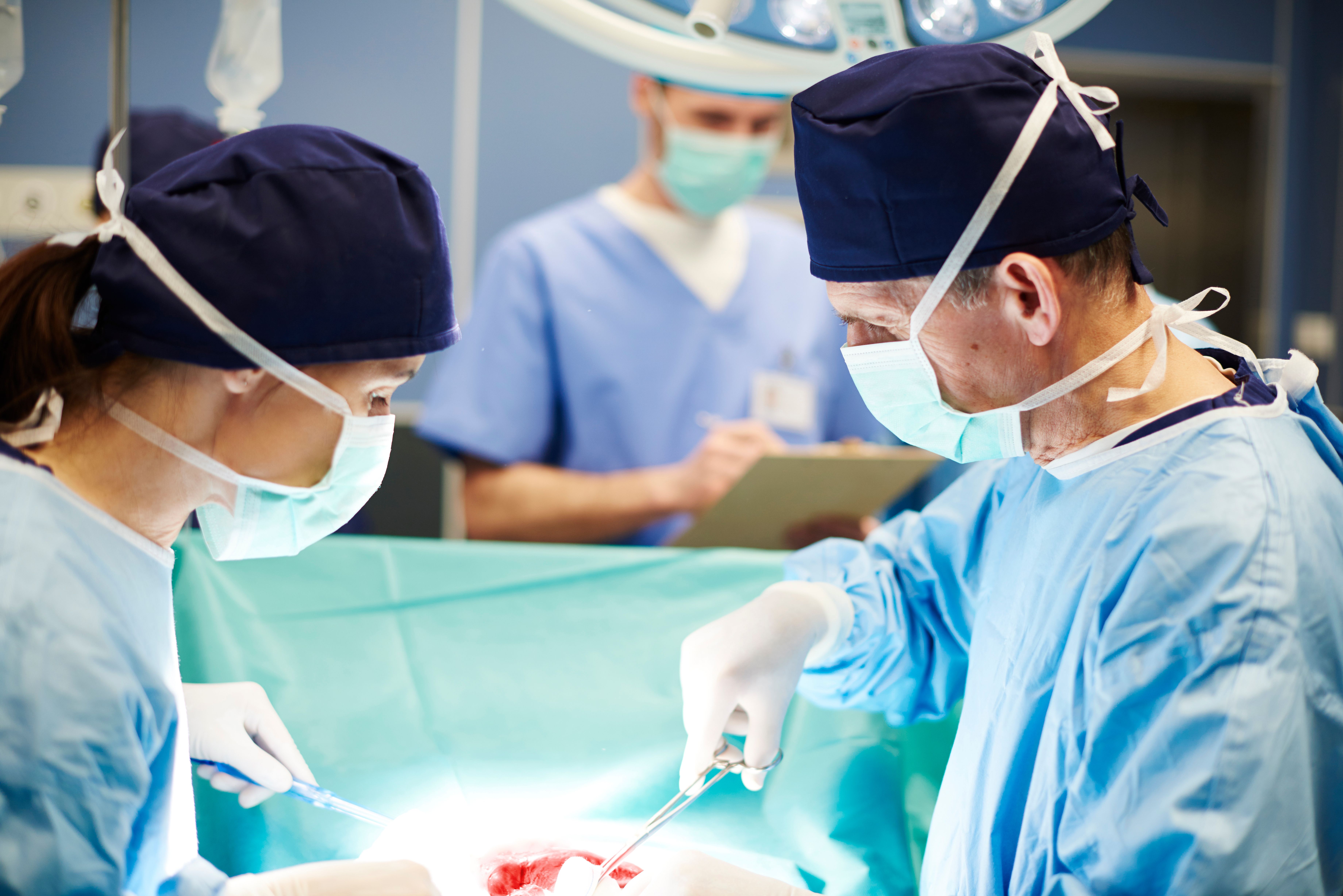 Busy surgeons over the operating table - Image credit: gpointstudio | stock.adobe.com