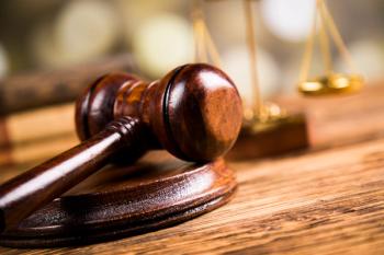 Golden scales of justice, books, Statue of Lady Justice. Owl and paragraph | Image credit: Dianaduda - stock.adobe.com 