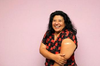 Body positive overweight adult laina woman shows her arm recently vaccinated against Covid-19 in the new normal for the Coronavirus pandemic