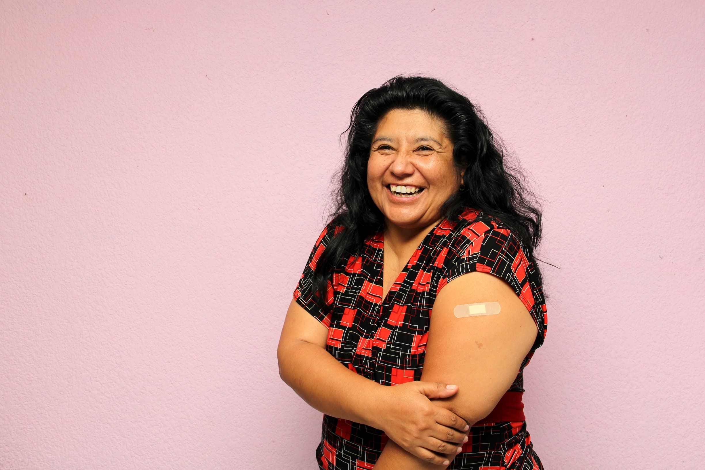 Body positive overweight adult laina woman shows her arm recently vaccinated against Covid-19 in the new normal for the Coronavirus pandemic Body positive overweight adult laina woman shows her arm recently vaccinated against Covid-19 in the new normal for the Coronavirus pandemic