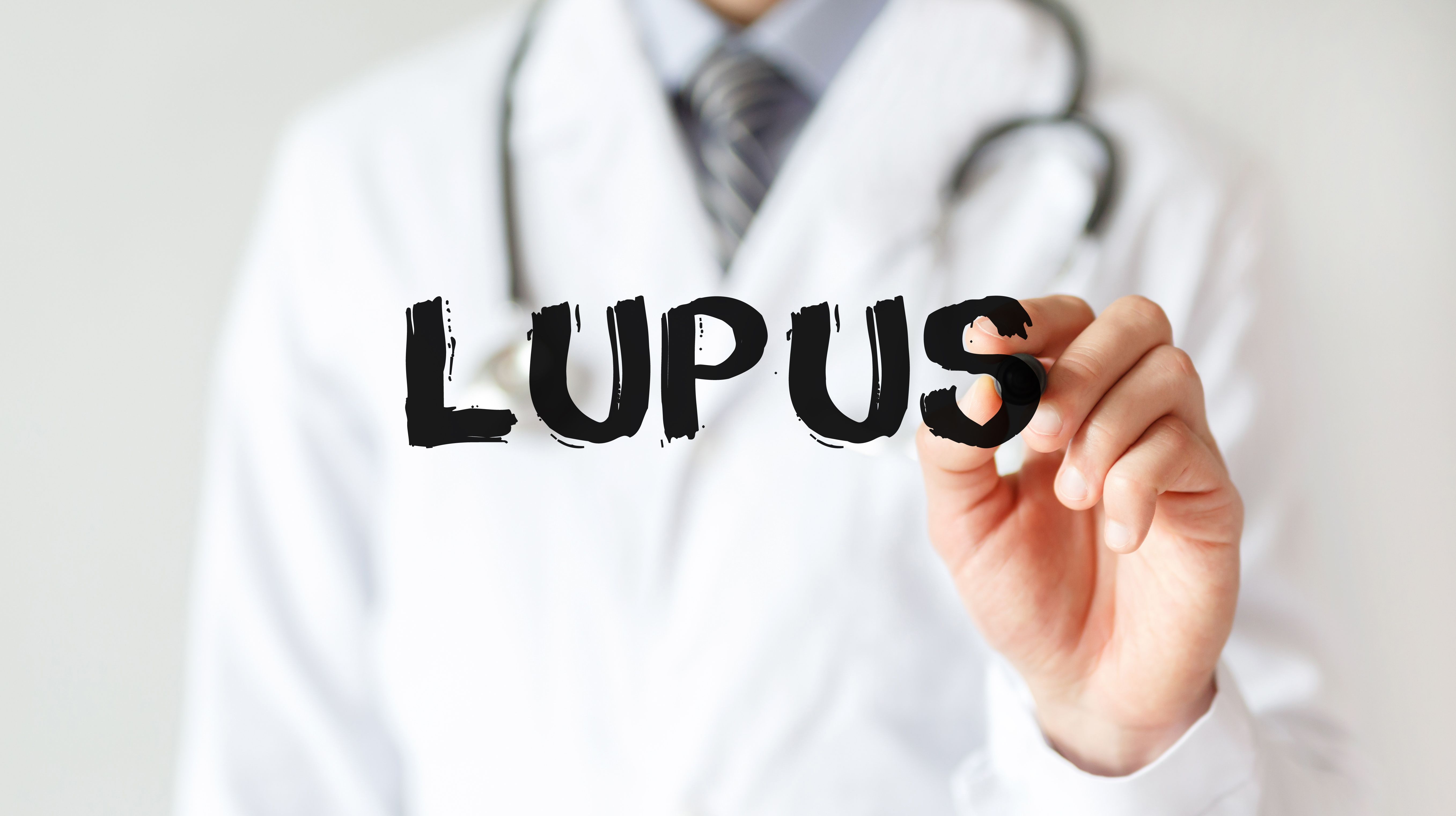 Doctor writing lupus in black marker | Image credit: MP Studio - stock.adobe.com