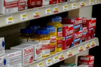 Calgary, Alberta, Canada Nov 10, 2022. A self full stock of Tylenol at a pharmacy over-the-counter medicine.