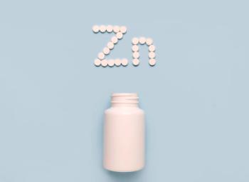 Chemical element Zinc Zn icon from tablets and drug bottle on blue background. Colltction of vitamin and minerals - Image credit: Iryna | stock.adobe.com