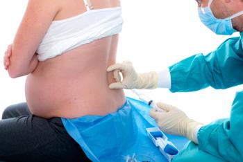 Women in labor receiving epidural -- Image credit: Firma V | stock.adobe.com
