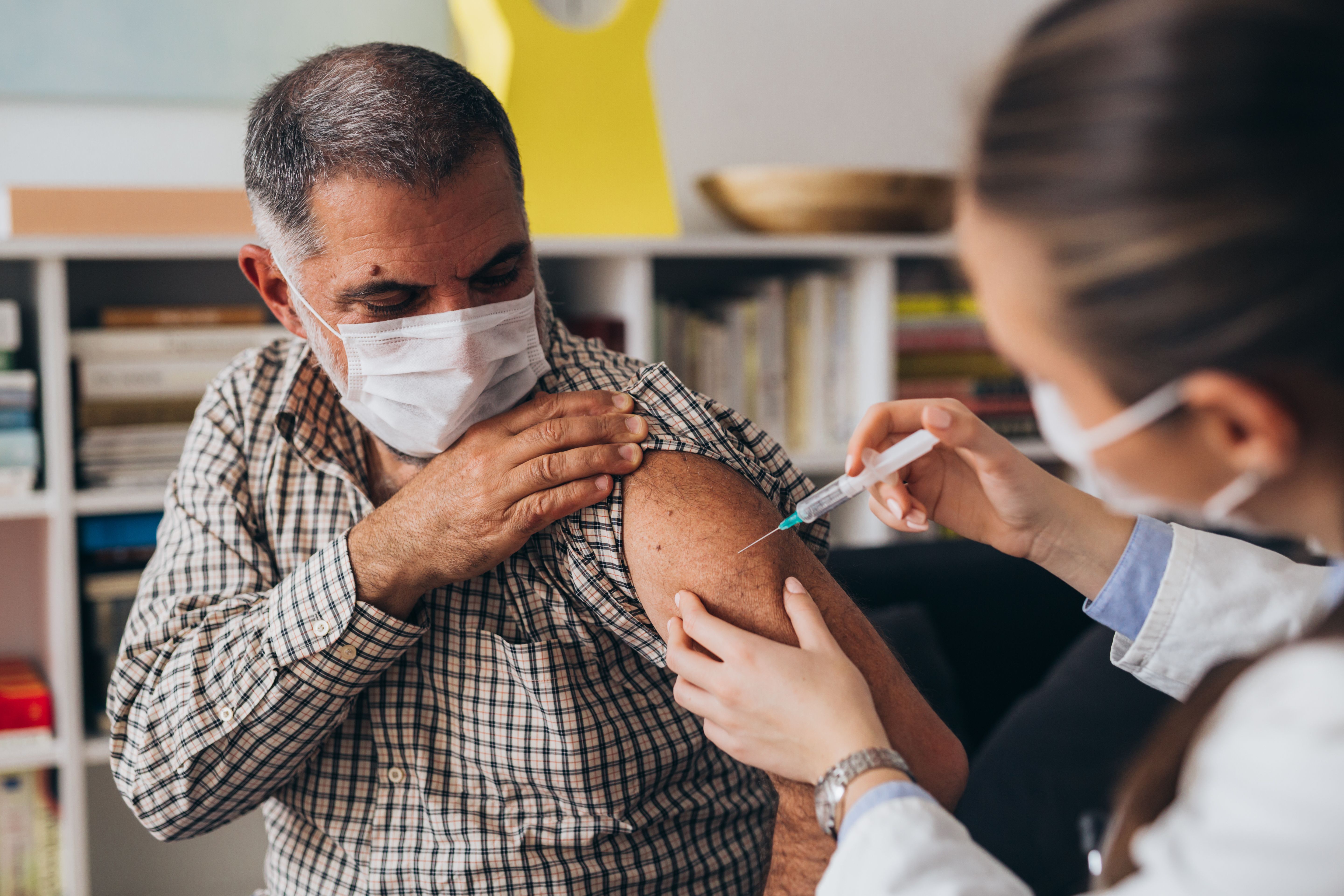 Patient receiving a vaccine -- Image credit: cherryandbees | stock.adobe.com