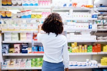 Back, pharmacy and medication with a woman customer buying medicine from a shelf in a dispensary. Healthcare, medical or treatment with a female consumer searching for a health product in a drugstor - Image credit: Arnell Koegelenberg/peopleimages.com | stock.adobe.com