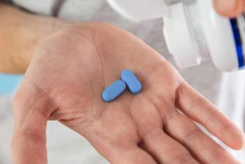 Man holding oral PrEP