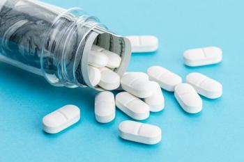 Medicine cost concept. US Dollars and medicine pills spilling from medicine bottle | Image Credit: Abdull | stock.adobe.com