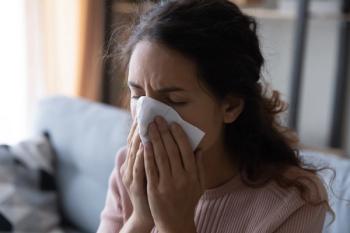 Close up head shot unhealthy young lady using paper tissue, wiping runny nose. Unhappy stressed woman suffering from seasonal allergy or caught cold, blowing nose or coughing in handkerchief | Image credit: Fizkes - stock.adobe.com