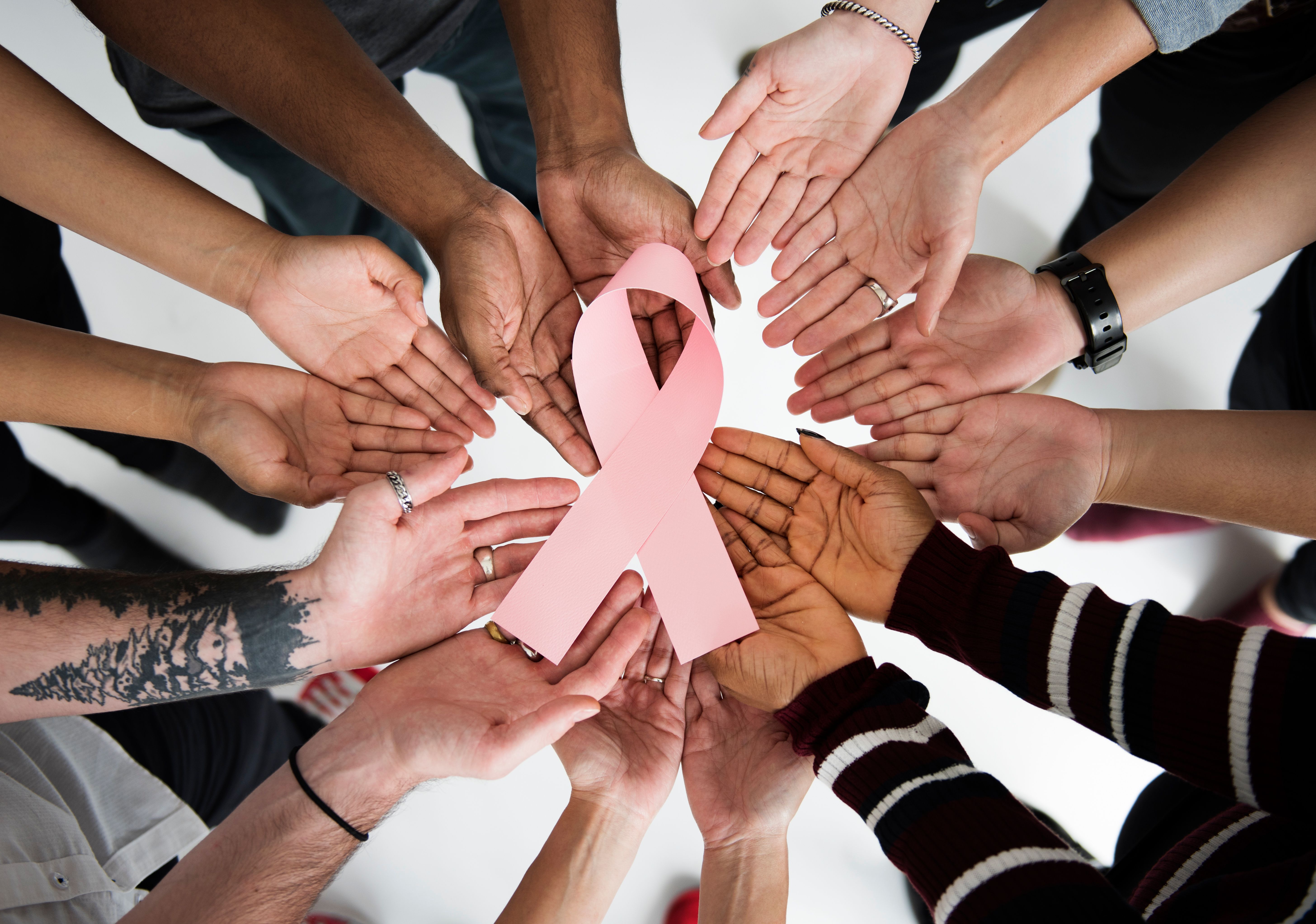 Group of women holding breast cancer ribbon | Image Credit: © Rawpixel.com - stock.adobe.com