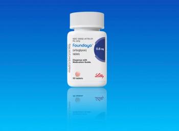 Studio shot of bottle of foundayo weight loss; pill from Eli Lilly on blue background with copy space. Copenhagen, Denmark - May 1, 2026 - Image credit: Ole | stock.adobe.com