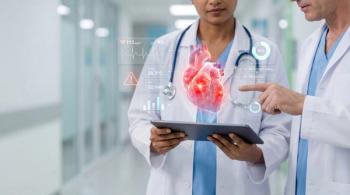 Doctors reviewing critical cardiac vitals on digital holographic interface with 3D heart model | Image Credit: Eduardo Accorinti | stock.adobe.com