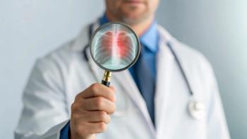 Doctor holding magnifying glass showing lung cancer screening | Image Credit: © AucArtStudio - stock.adobe.com