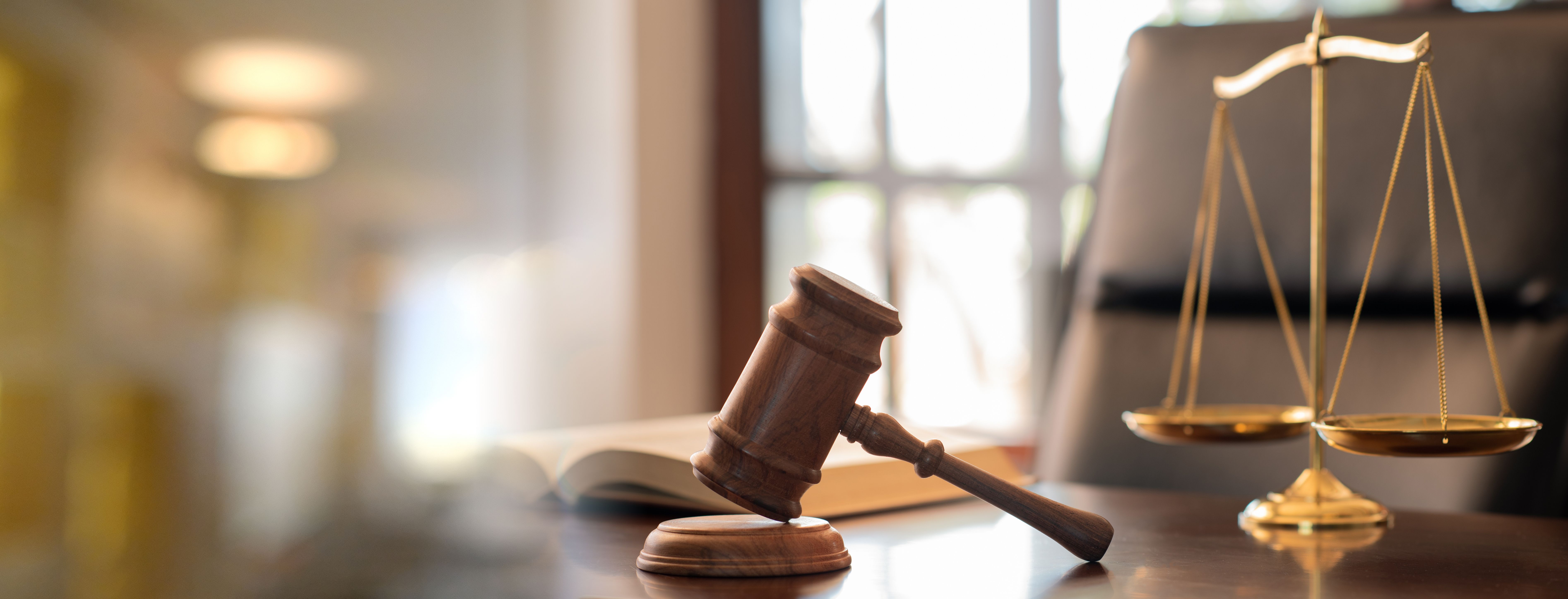 Judge gavel, law books and scales of justice on desk in lawyer office. legal justice concept. - Image credit: utah51 | stock.adobe.com