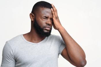 Man with headache | Image credit: Prostock-studio - stock.adobe.com
