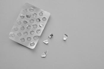 Pills blister pack on a white background. Top view food supplements empty packaging. Medicine shortage concept. Running out of drugs.