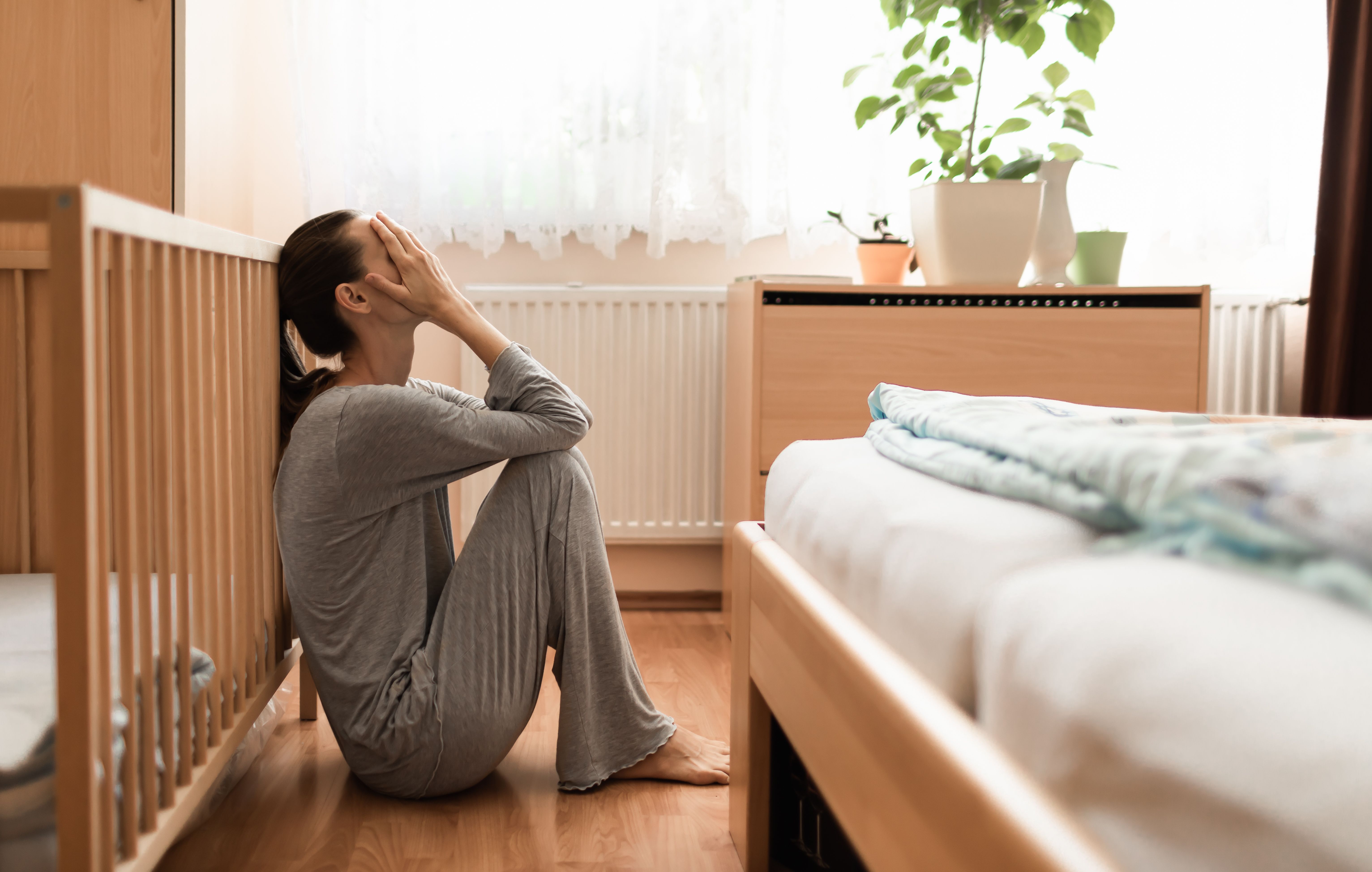Woman with postpartum depression -- Image credit: kieferpix | stock.adobe.com