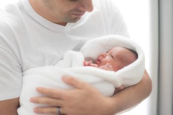 Man holding his newborn