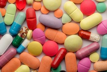 Multicolored tablets on white background | Image credit: Grthirteen - stock.adobe.com