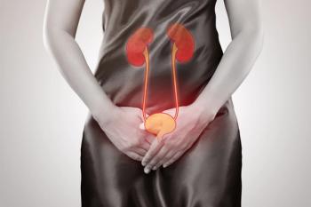 Woman with pain from UTI -- Image credit: eddows | stock.adobe.com