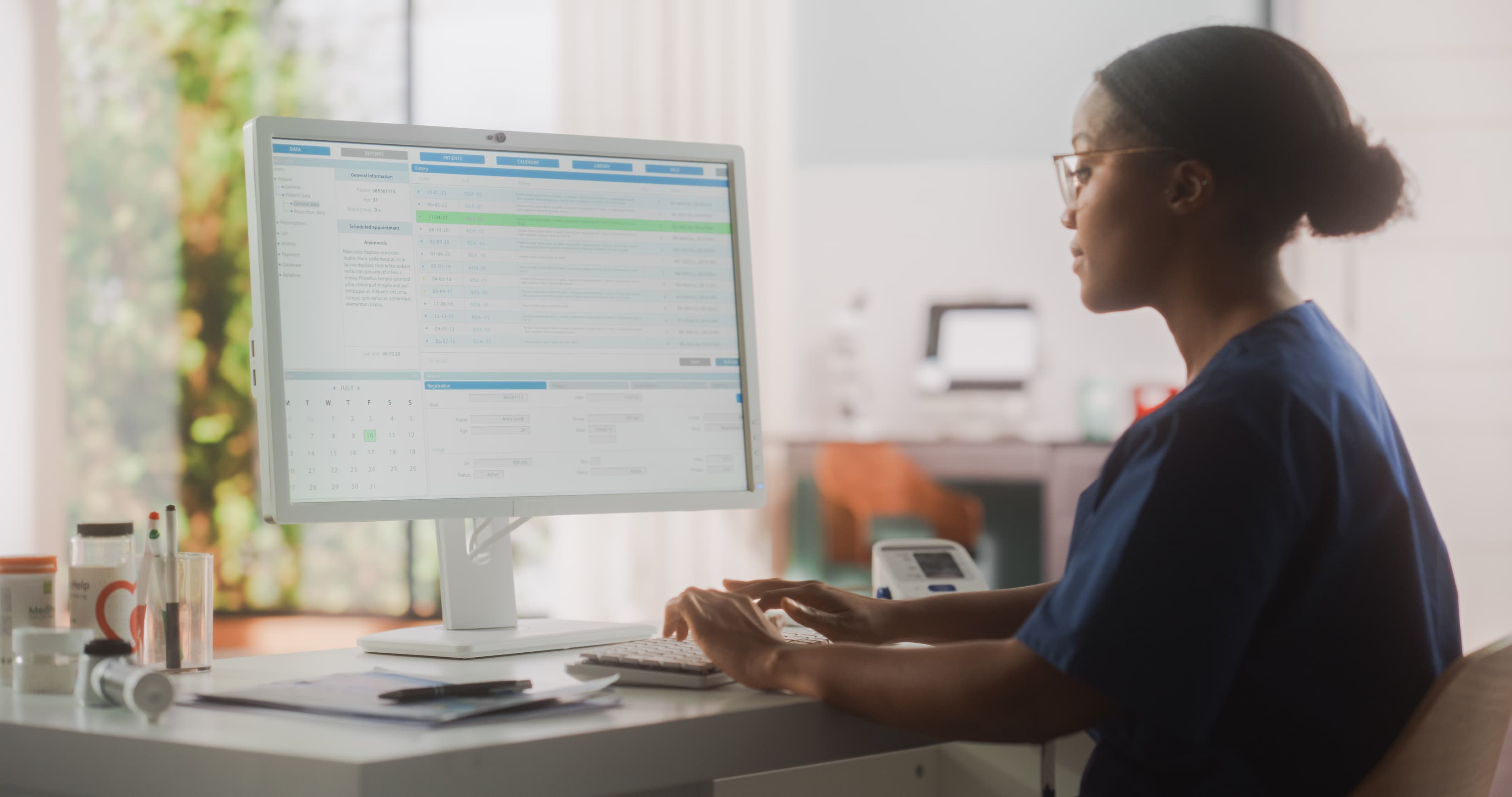 Portrait of a Medical Health Care Professional Working on Desktop Computer in Hospital Office. Clinic Head Nurse is Appointing Prescriptions Online, Updating Electronic Health Records
