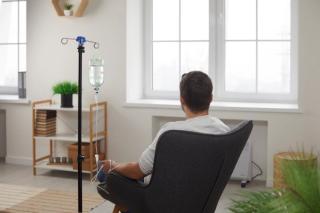 Man receiving medication infusion | Image credit: Studio Romantic - stock.adobe.com