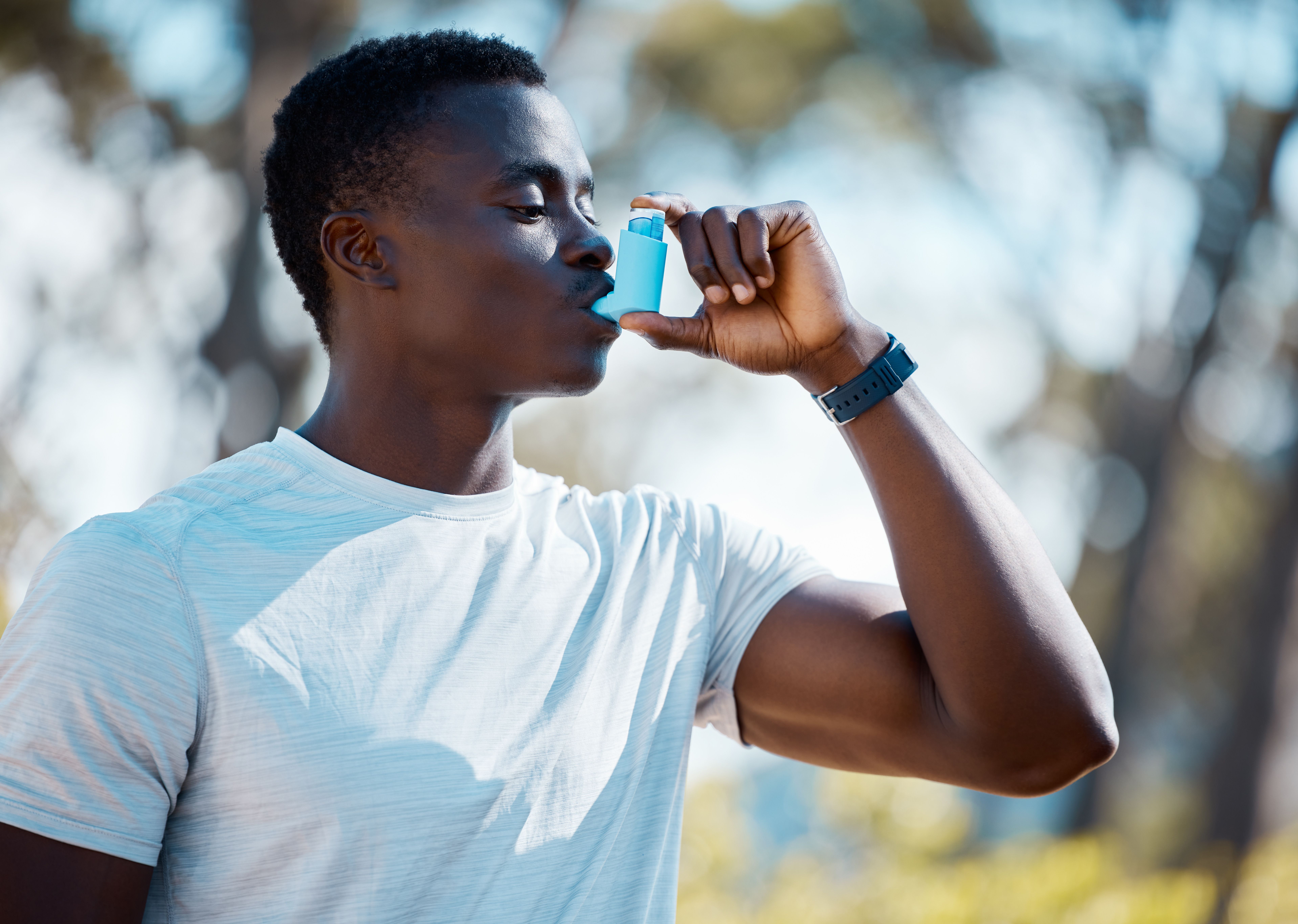 Man with asthma using inhaler -- Image credit: Anela R/peopleimages.com | stock.adobe.com
