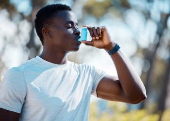 Man with asthma using inhaler -- Image credit: Anela R/peopleimages.com | stock.adobe.com