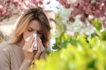 Woman suffering from seasonal pollen allergy outdoors - Image credit: New Africa | stock.adobe.com