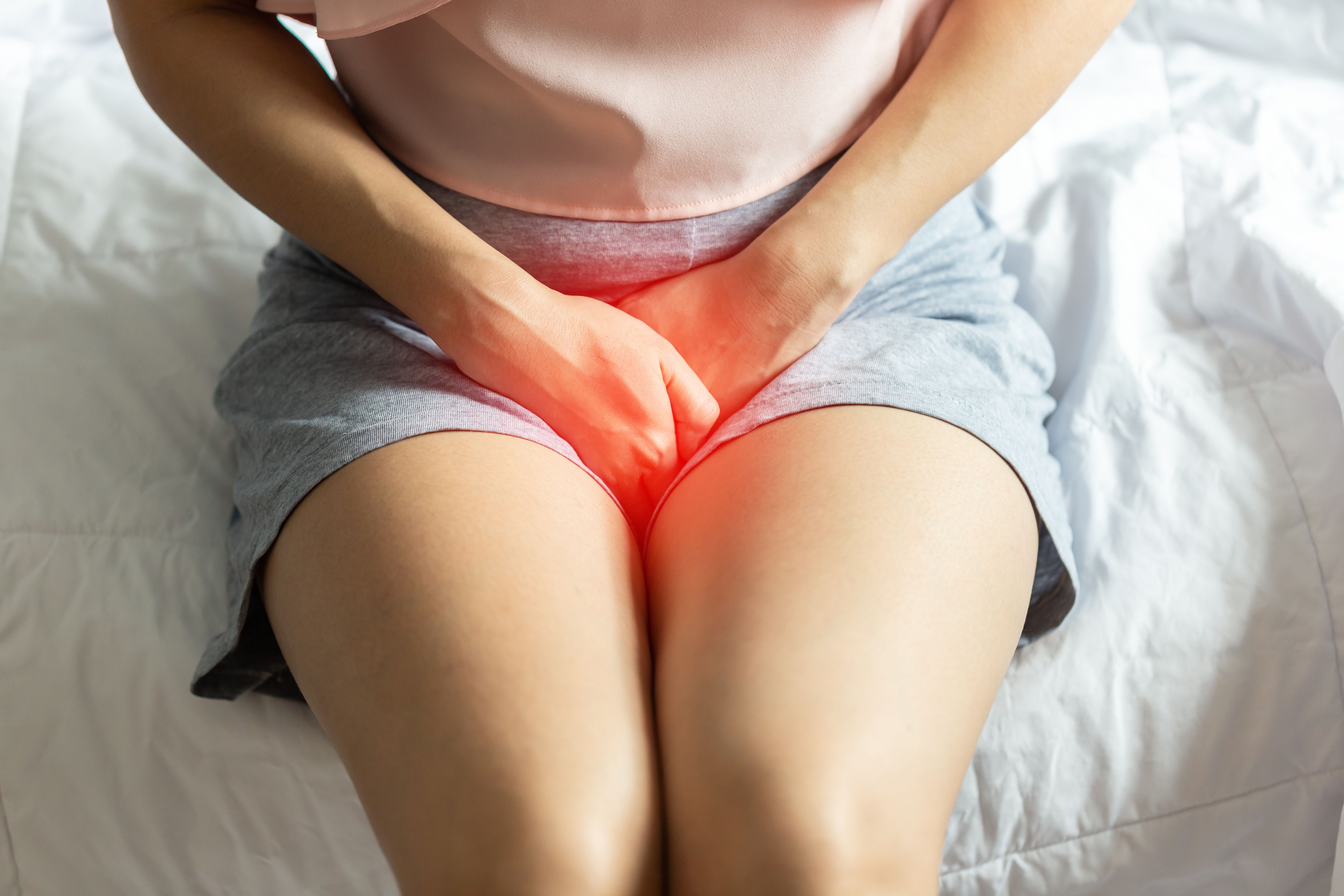 Woman experiencing pain from UTI -- Image credit: 220 Selfmade studio | stock.adobe.com