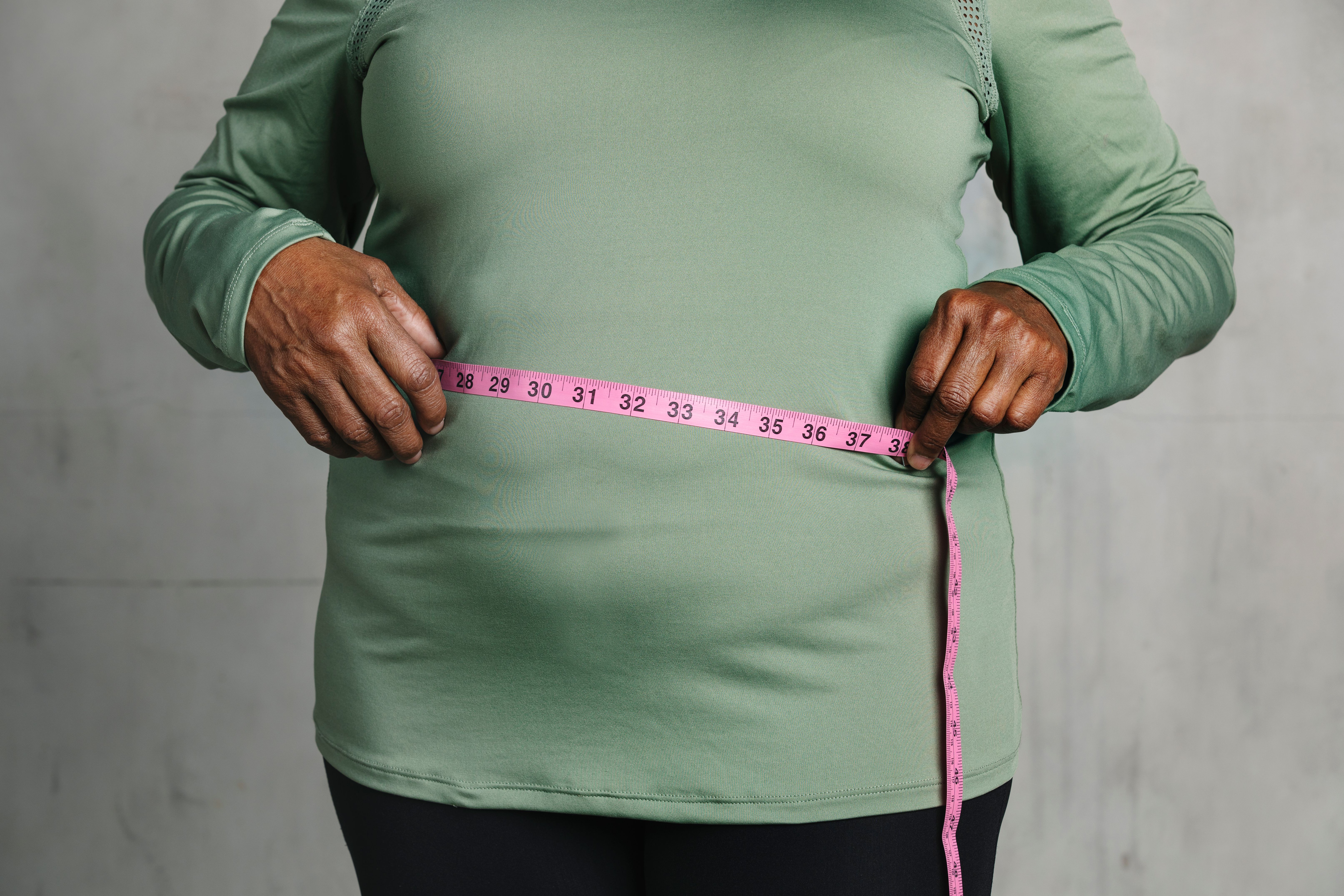 Woman measuring her tummy- Image credit: Rawpixel.com | stock.adobe.com