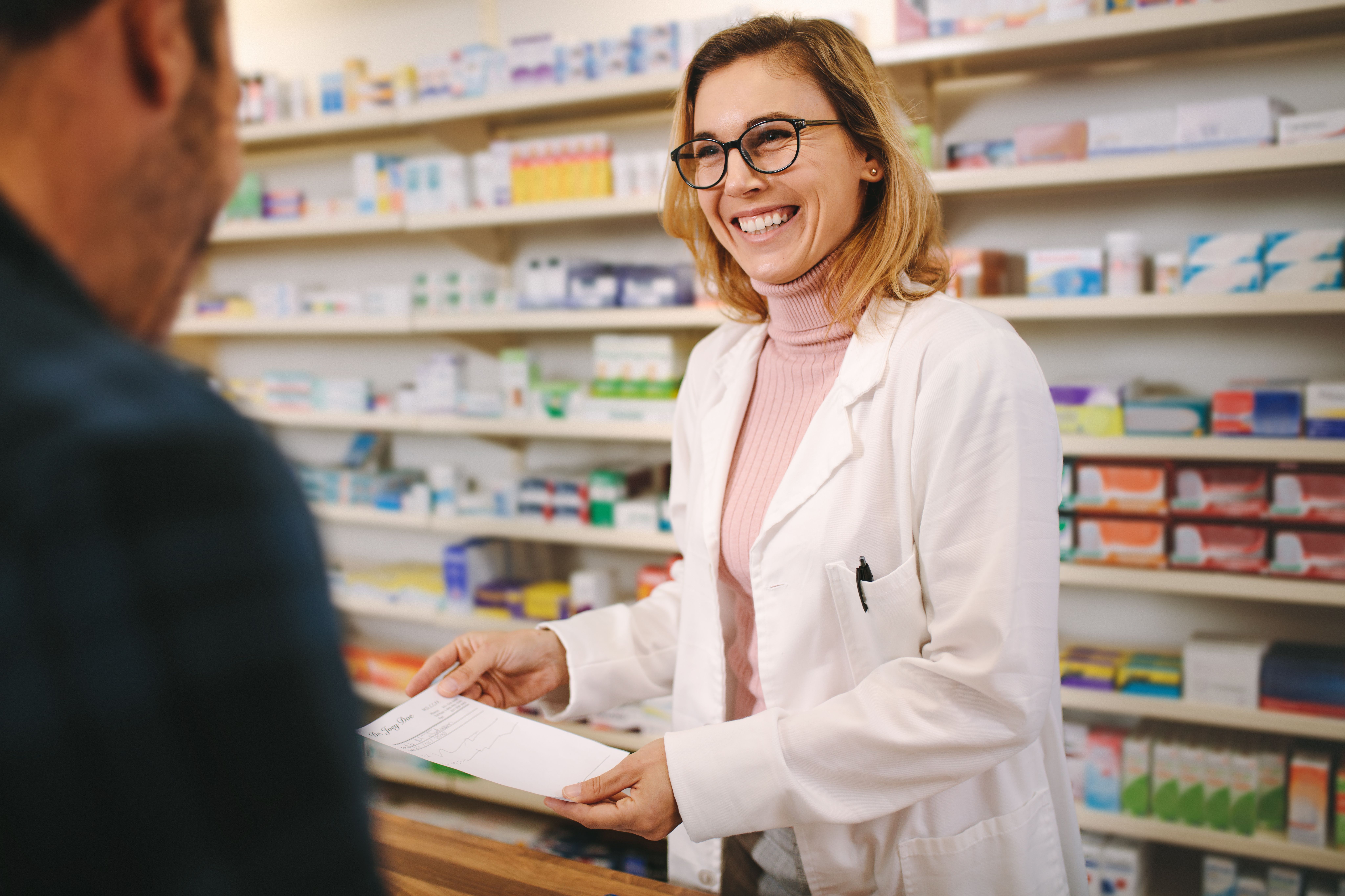 Helpful pharmacist dealing with a customer - Image credit: Jacob Lund | stock.adobe.com