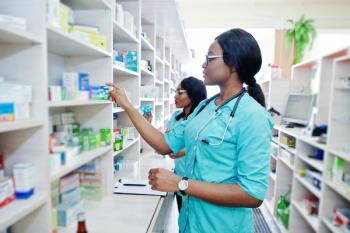 Two African American pharmacists working in drugstore at hospital pharmacy | Image Credit: © AS Photo Family - stock.adobe.com