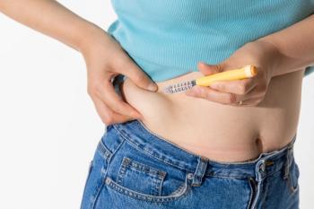 A woman injecting herself with obesity medication - Image credit: Choi_ Nikolai | stock.adobe.com 
