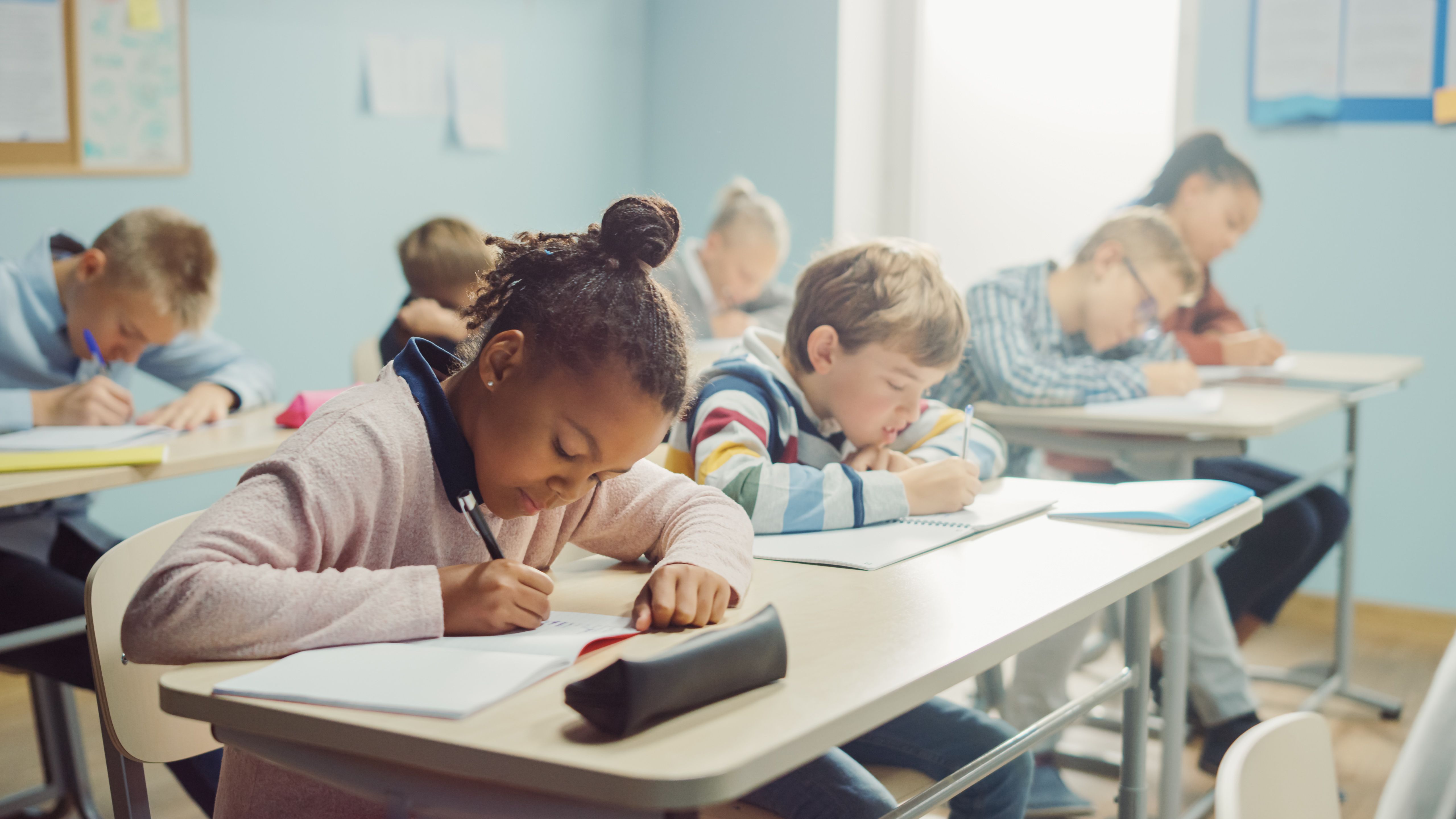 Children in school -- Image credit: Gorodenkoff | stock.adobe.com