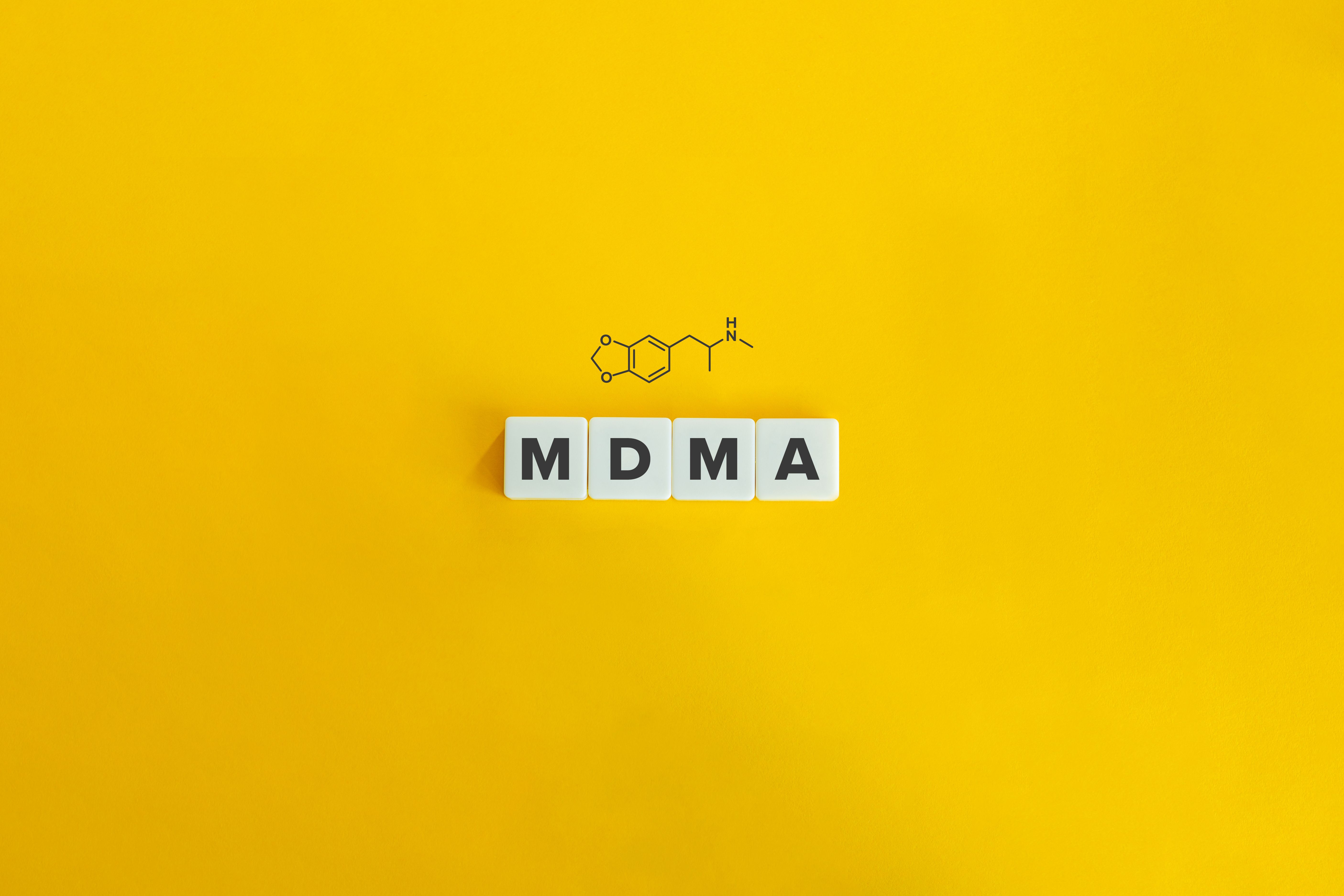 MDMA banner and concept. Block letters on bright orange background. Minimal aesthetics.