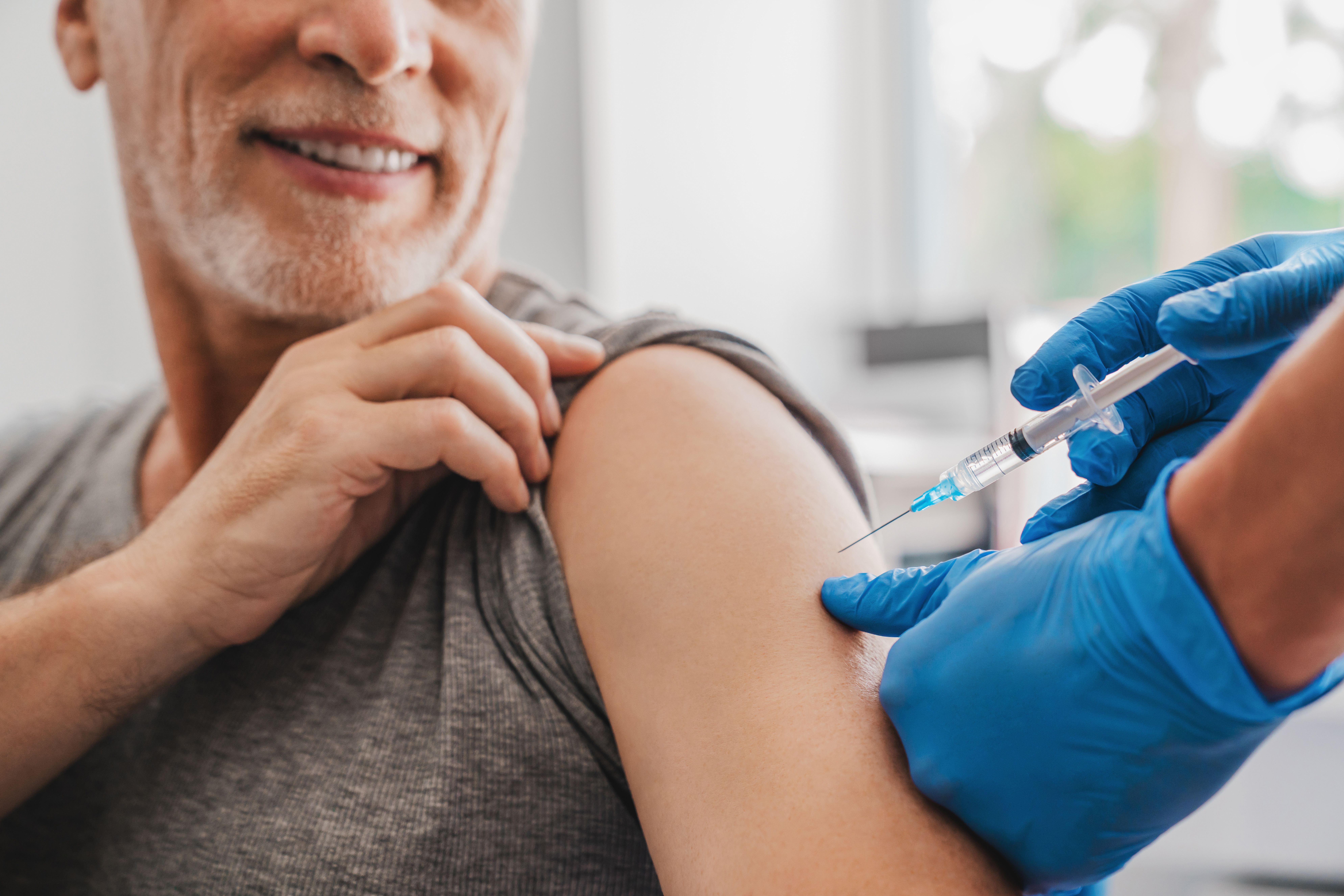 Doctor making injection to senior patient in clinic | Image Credit: InsideCreativeHouse | stock.adobe.com