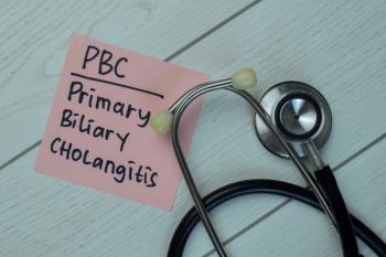 PBC - Primary Biliary Cholangitis write on sticky notes isolated on Wooden Table