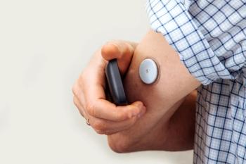 Patient using a glucose monitor -- Image credit: NataliAlba | stock.adobe.com