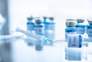 Some ampoules with covid-19 vaccine and syringe injection. Pandemic time - Image credit: Daniel Jędzura | stock.adobe.com