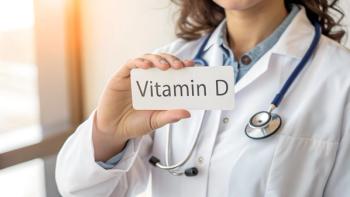 Doctor in white coat with stethoscope holds vitamin D sign in hand - close-up | Image Credit: Petr Babkin | stock.adobe.com
