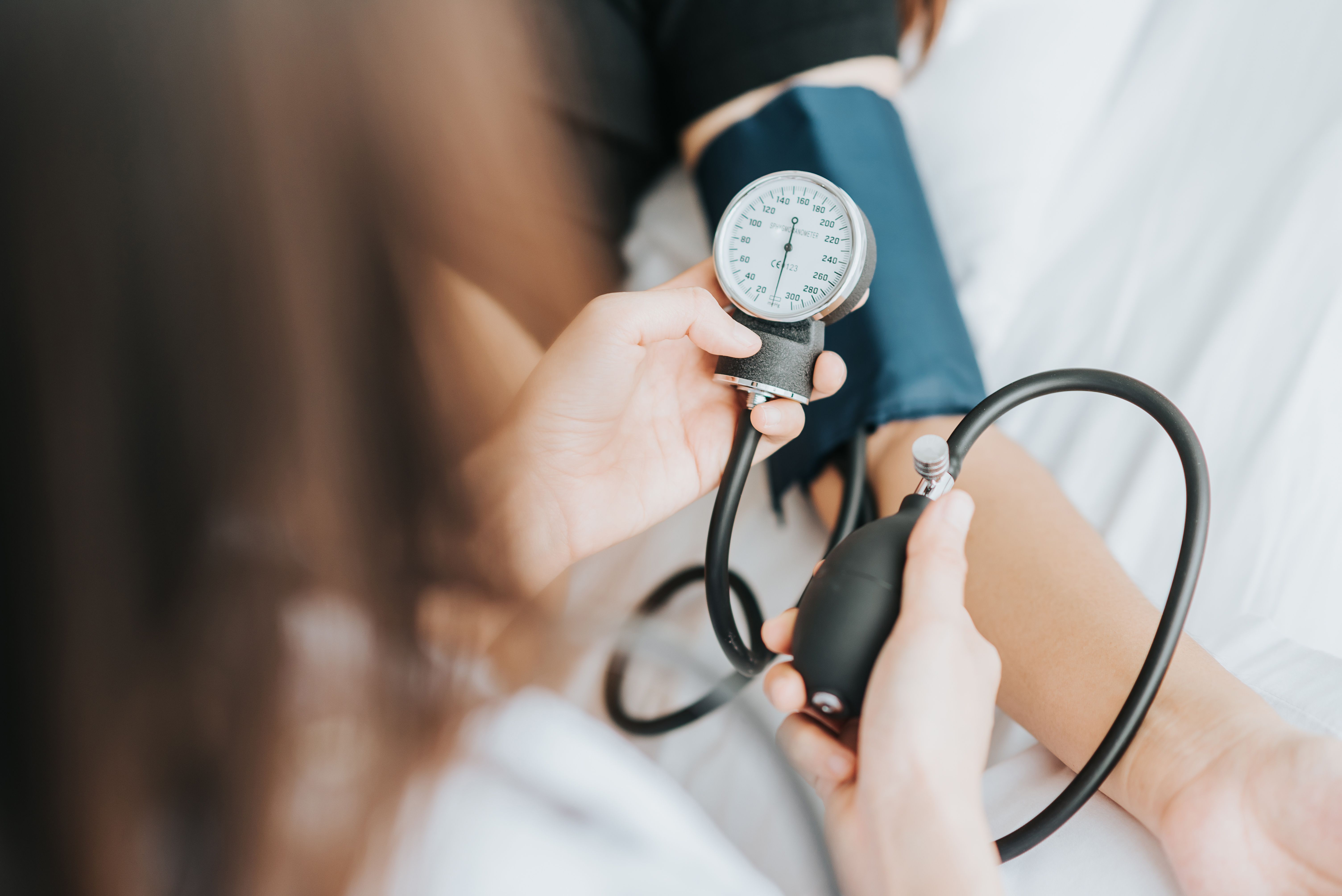 Patient having their blood pressure measured -- Image credit: interstid | stock.adobe.com