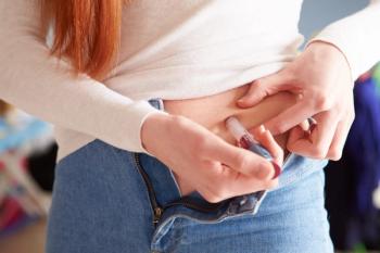 Woman injecting insulin